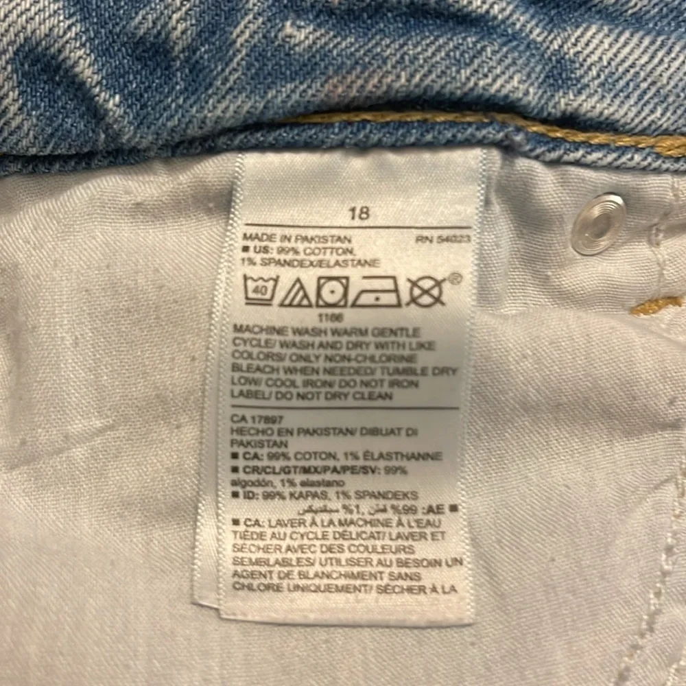 Old Navy - medium wash distressed blue jean shorts - button fly - size 18